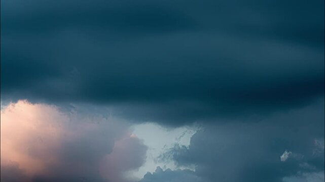 Time-Lapse of Windy Pink and Blue Clouds Moving Across Dramatic Sky