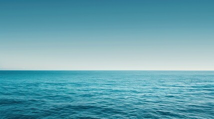 Obraz premium Calm Ocean Water Under a Clear Blue Sky