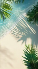 Fototapeta premium Palm leaves cast shadows on soft sand as gentle waves lap at the beach under clear blue skies