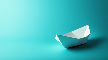 Naklejka premium A white paper boat on a turquoise background.