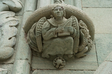 Decorative (mythical character - Angel with a harp) ornament of a column in the old city. Las Palmas, Gran Canaria. Canary Islands. Spain.