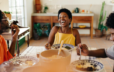 Black family sharing a traditional Brazilian meal together