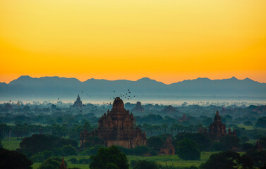 group of ancient pagodas in Bagan at the sun set, myanmar