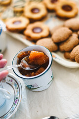 Breakfast table in italy. Cookies and marmalade.