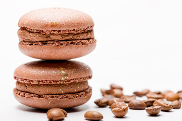Macaroons with chocolate cream on a light background.