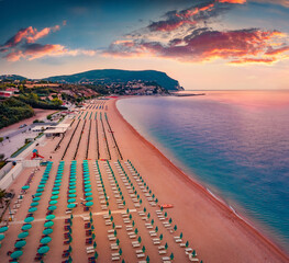 Astonishingl summer sunrise in Numana public beach. Exciting morning seascape of Adriatic sea. Nice...