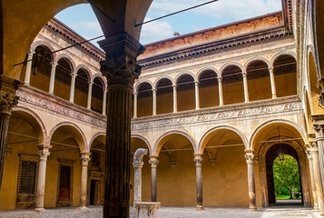 The courtyard of Palazzo Bevilacqua Ariosti with small drinking fountain in the middle in Bologna,...