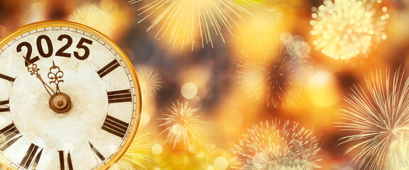 2025 New Year with clock counting down to midnight with defocused golden background and fireworks