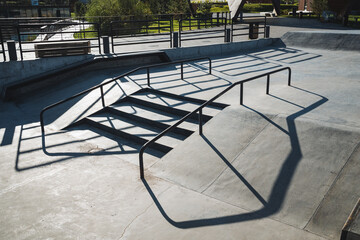 A distinct shadow of a beautifully designed staircase is cast upon a smooth and unblemished...
