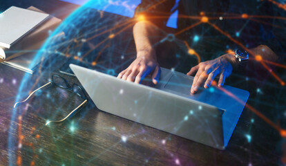Close-up of male hands with laptop. Man is working remotely at home. Freelancer at work