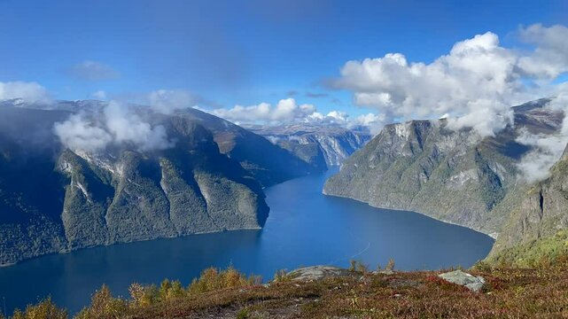 Aurlandsfjord &ndash; Timelapse of Moving Clouds over Mountain Lake