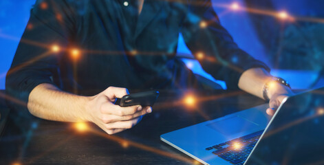 Close-up of male hands with laptop. Man is working remotely at home. Freelancer at work