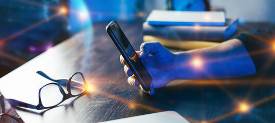 Close-up of male hands with laptop. Man is working remotely at home. Freelancer at work