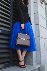 Chic Urban Fashion Ensemble Showcasing a Beautiful Tulle Skirt Paired with a Stylish Structured...