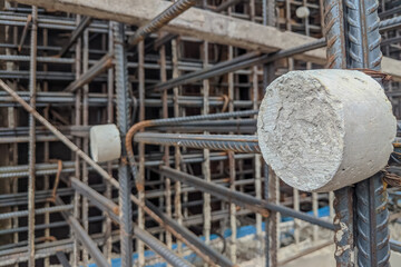 selective focus of concrete spacer that provides the exact ratio, correct distance of concrete to...