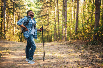 Hiker has got backache while hiking in the nature.	
