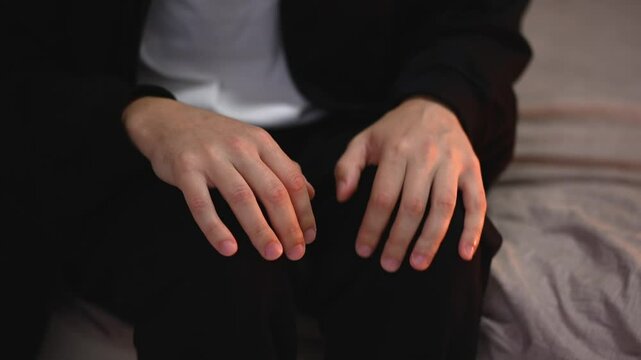 The man is nervous.
A young guy has a nervous breakdown.
The man is shaking with fear.
Trembling throughout the body.
The guy is in shock.
The guy is in severe shock and stress.
Nerves, stress, fear