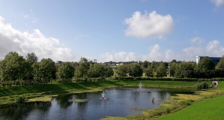 Trees and the pond on a sunny day in Blackrock Park, Monkstown, Dublin, Ireland