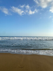 beach waves with clear skies