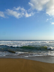 beach waves with clear skies