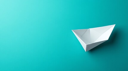 A white paper boat on a blue background.