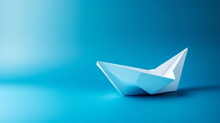 A white paper boat on a blue background.