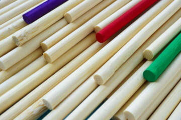 Identical sticks and few colorful ones. Symbolizes individuality and diversity.