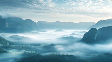 Fototapeta premium Misty Mountains Shrouded in Fog with a Valley Below