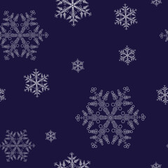 Seamless pattern with snowflakes on a blue background