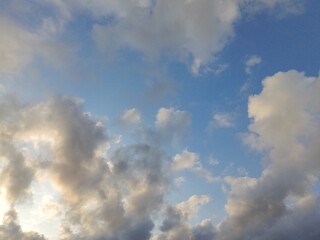 beautiful cloudy sky sunlight from the side, dramatic feel, it's going to rain