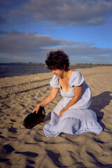 a young plus size woman walking and playing with her pet rabbit by the sea in Copenhagen