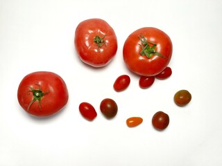 Fresh tomato and cherry tomato. Healthy vegetables. Food ingredient. Vegetables background