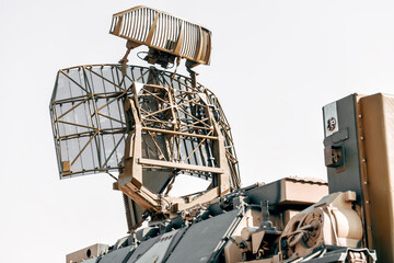 Military radar antenna scanning for enemy activity on battlefield