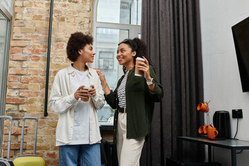 A happy couple shares warm moments and laughter while relaxing in their hotel room.