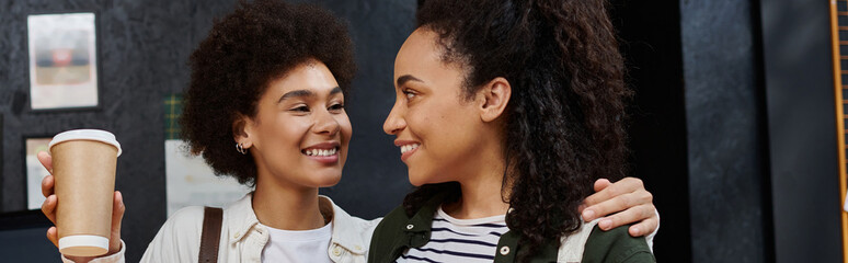 A joyful couple checks in at the hostel, excited for their travel adventure.