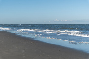 surf at the north sea in the early morning