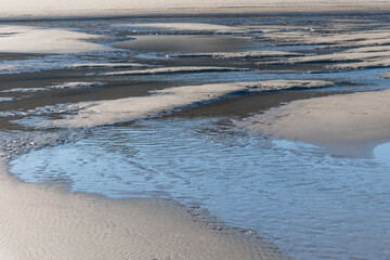 Low tide, which drains the seawater from the North Sea
