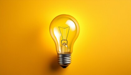 Glowing light bulb, on yellow background. Copy space for text