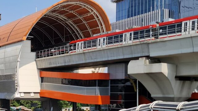 Jakarta, Indonesia on April 8 2024. The atmosphere in the Cawang Ciliwung area, where the KAI Ciliwung LRT station and the Transjakarta bus stop are next to each other and are connected by a pedestria