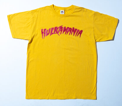 Kent, uk 01.01.2024 hulk hogan hulkamania yellow vintage tshirt fruit of the loom. Hulk wrestling unites states of America Americana merchandise. Fruit of the loom yellow t-shirt double stitch.