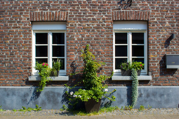 Old German house with white windows and flower pots