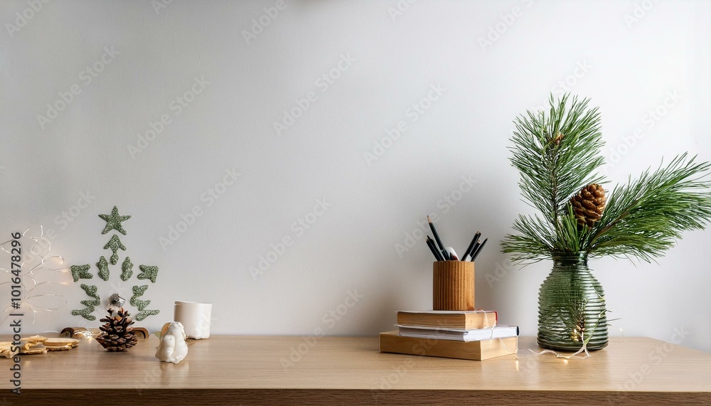 Poster a cozy and festive workspace by featuring an empty white wall as a mock-up background. a desk with h