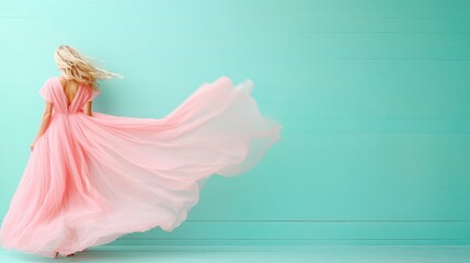 A woman strikes a pose in a billowing pink dress in front of a vibrant green wooden wall, highlighting a blend of whimsy, softness, and creative elegance.