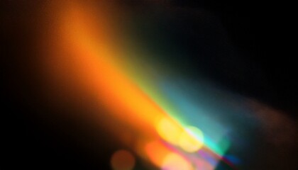 Grainy colorful warm rainbow light leaks on black background with dust texture. Defocused abstract damaged scratched retro film analog effect for using over photos as overlay or screen filter