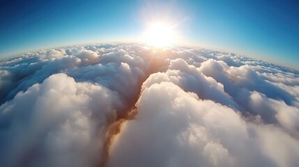 Fototapeta premium An inspiring vista with the sun rising over a sea of clouds, casting a radiant golden glow, infusing the scene with warmth and a sense of infinite possibility.