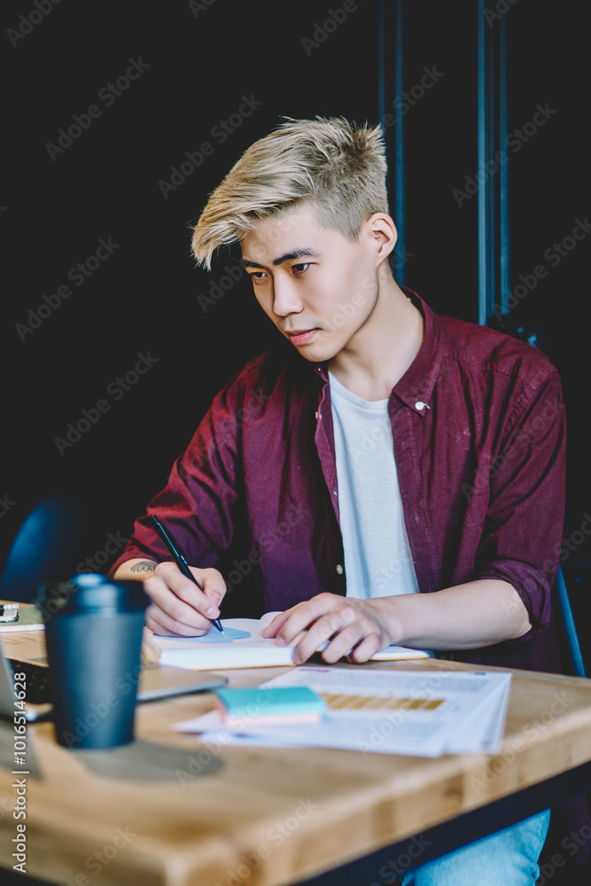 Aufkleber serious japanese hipster guy spending time for autodidact in coworking space watching knowledge info