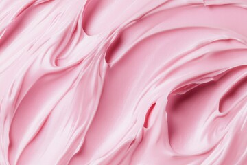 A close-up shot of pink frosting on a table, perfect for food and dessert-related concepts.