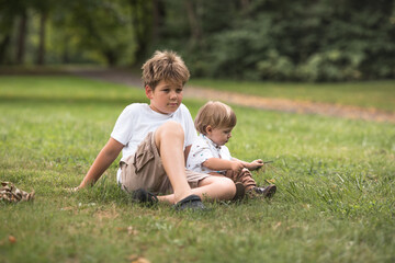 Brothers, Happy young brothers walking at the park. Friendship brotherhood concept