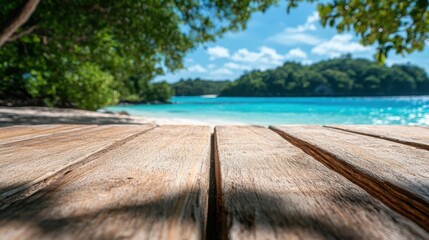 A scenic view of a tropical paradise with clear blue waters and lush greenery, framed by a rustic wooden deck that invites viewers to relax and soak up nature's beauty.