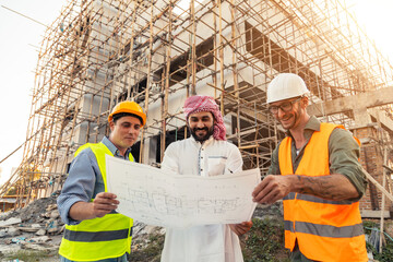 Architect engineer technician construction worker all working together as a team communicating, working on blueprint design planning analyzing innovation on building landscape housing architecture.